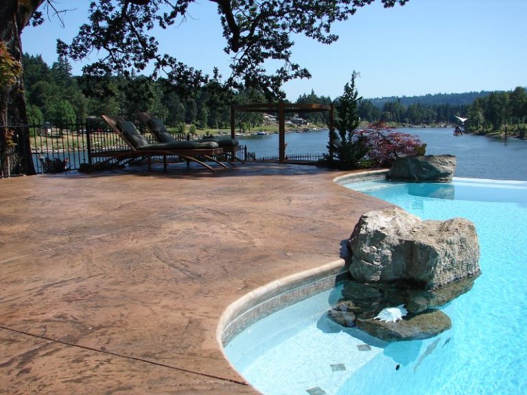 Pool side with large rock accent